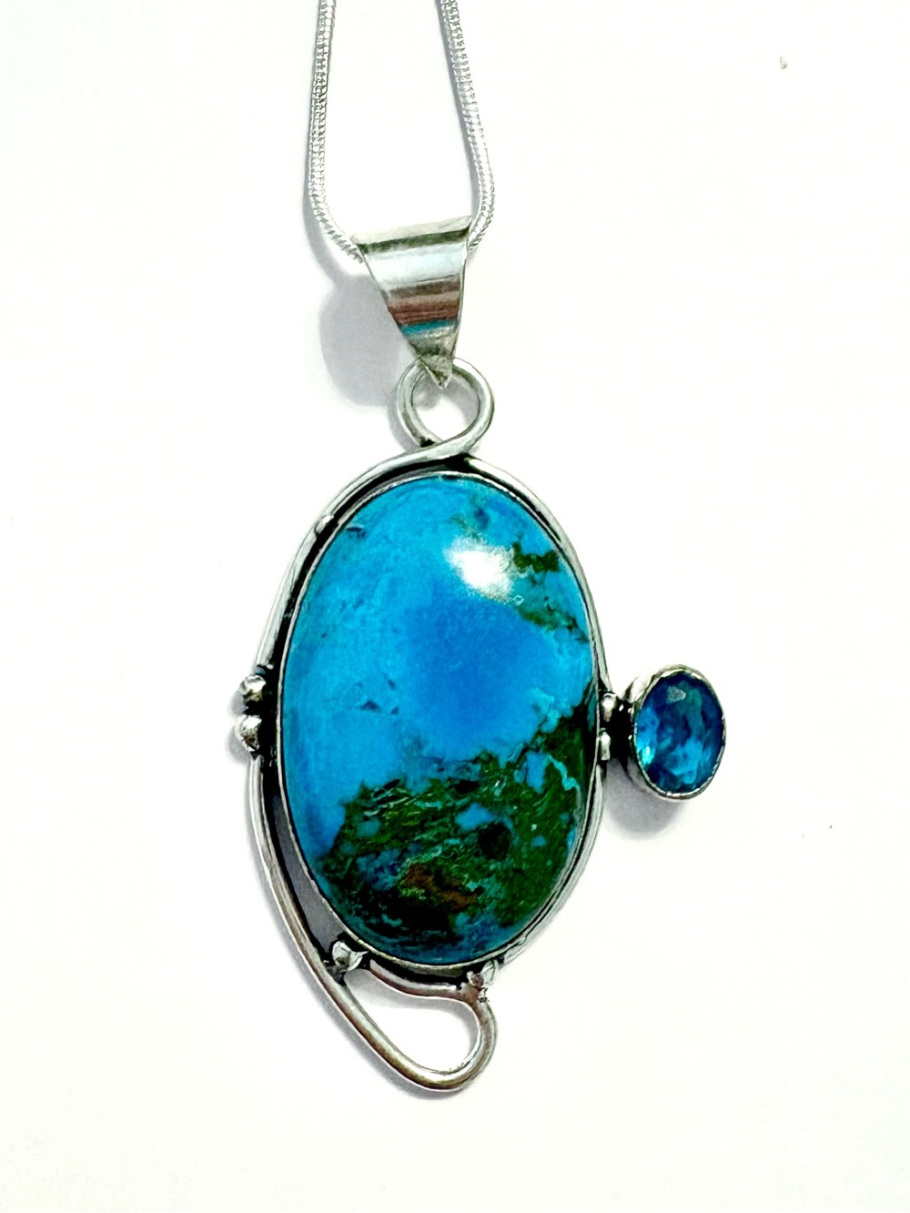 2 1/2 inch, 925 marked, Turquoise and Blue Topaz pendant on a silver chain.